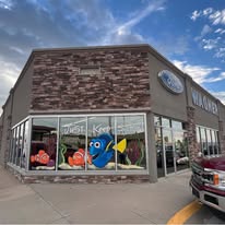 Community artwork displayed on the Wagner dealership windows