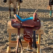 Wagner Ford rodeo saddle displayed outdoors