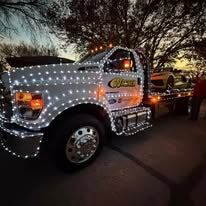 Wagner truck decorated with holiday lights for a parade