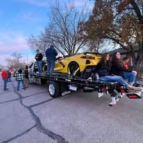 Race car displayed on a Wagner parade trailer